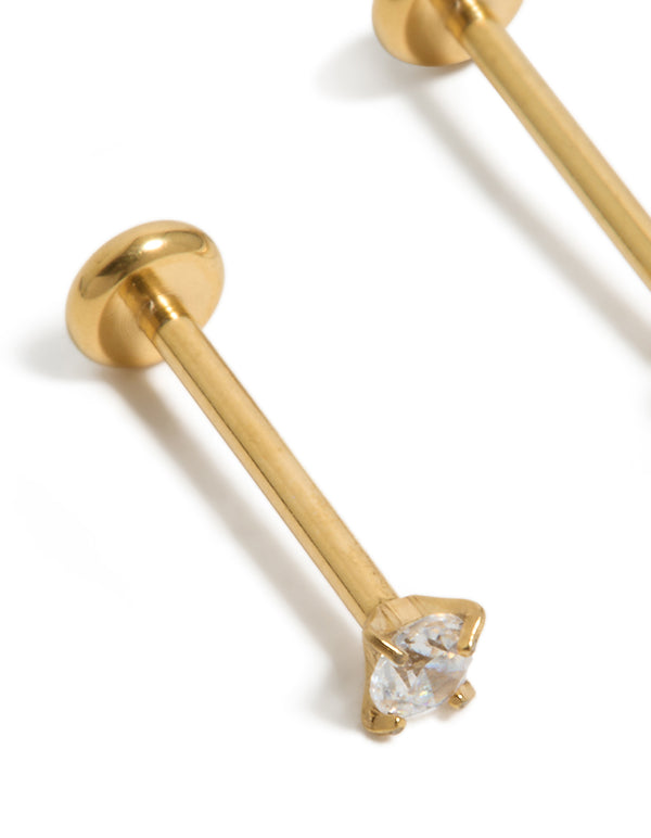 Highlighting gold plated titanium cubic zirconia threadless flat back nose stud with claw setting detail close up view
