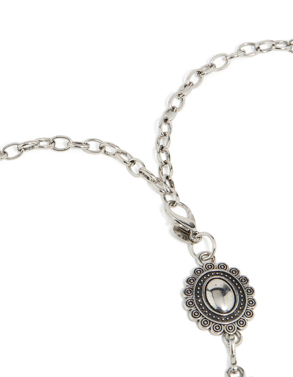 Highlighting an antique silver western scalloped oval belt with embellished waisted design and statement style side view