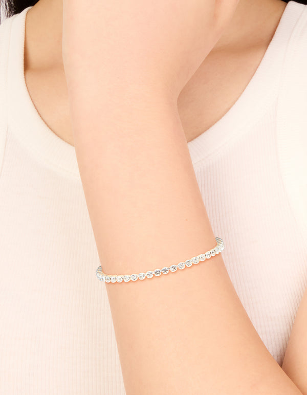 Featuring a silver plated diamante tennis bracelet with sparkling stones on wrist view