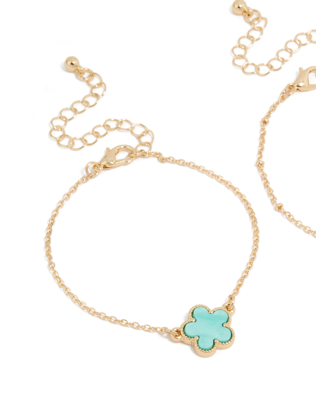 Featuring a 2-pack of bracelets with floral in gold and turquoise close up view