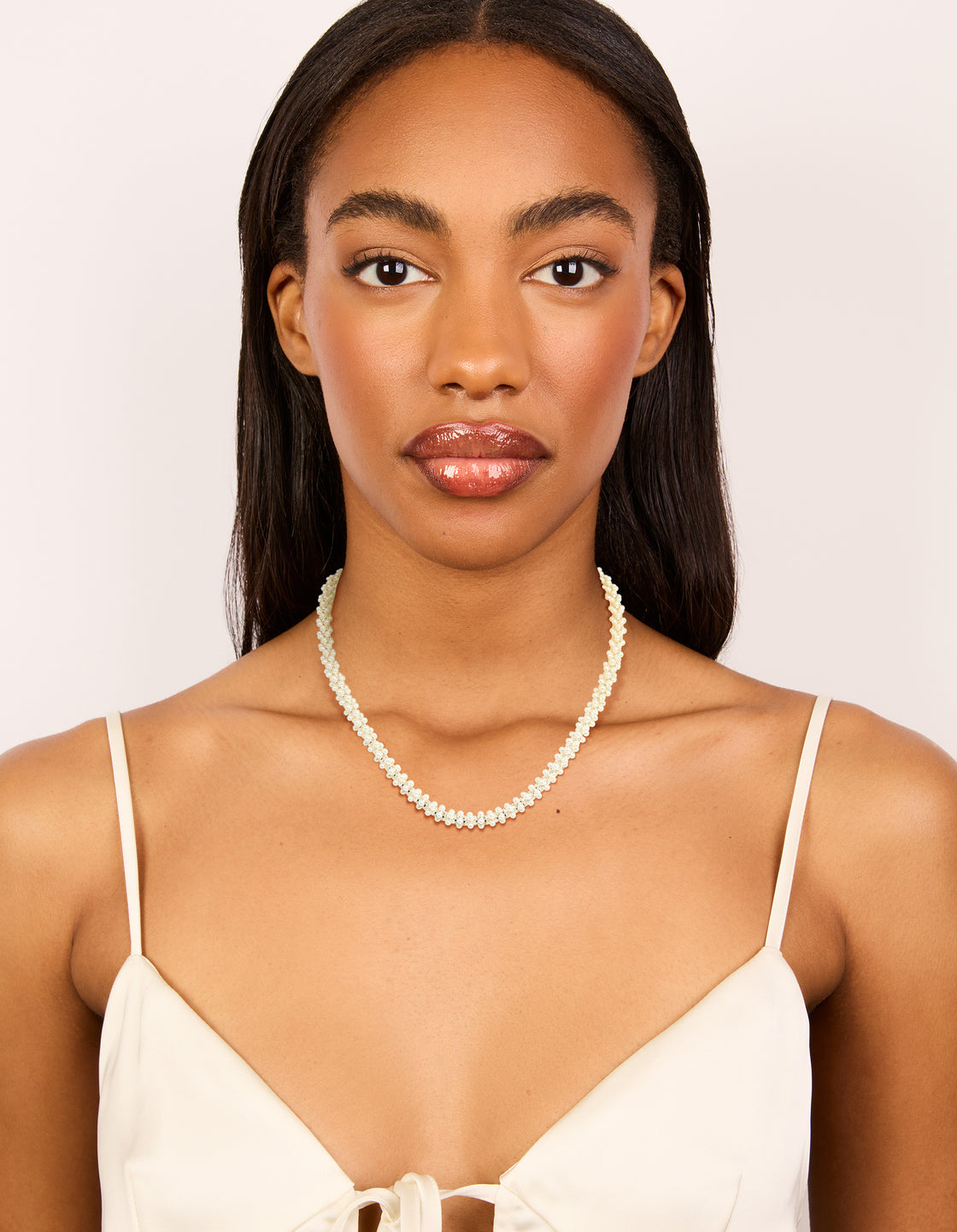 Stunning fireball pearl necklace crafted from silver plated metal on model view
