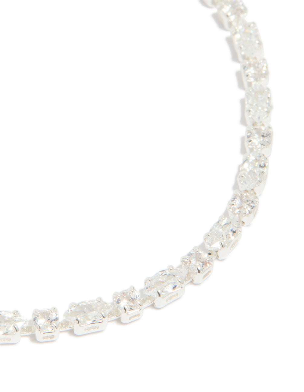 Highlighting the oval cut cubic zirconia stones, this silver plated dainty tennis bracelet is presented in close up view