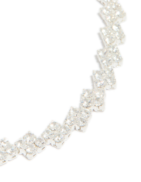 Crafted from silver plated cubic zirconia multi flower tennis bracelet with floral pattern close up view