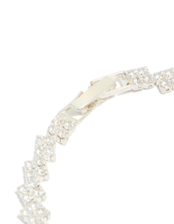 Featuring silver plated cubic zirconia multi flower tennis bracelet with floral pattern closure detail view