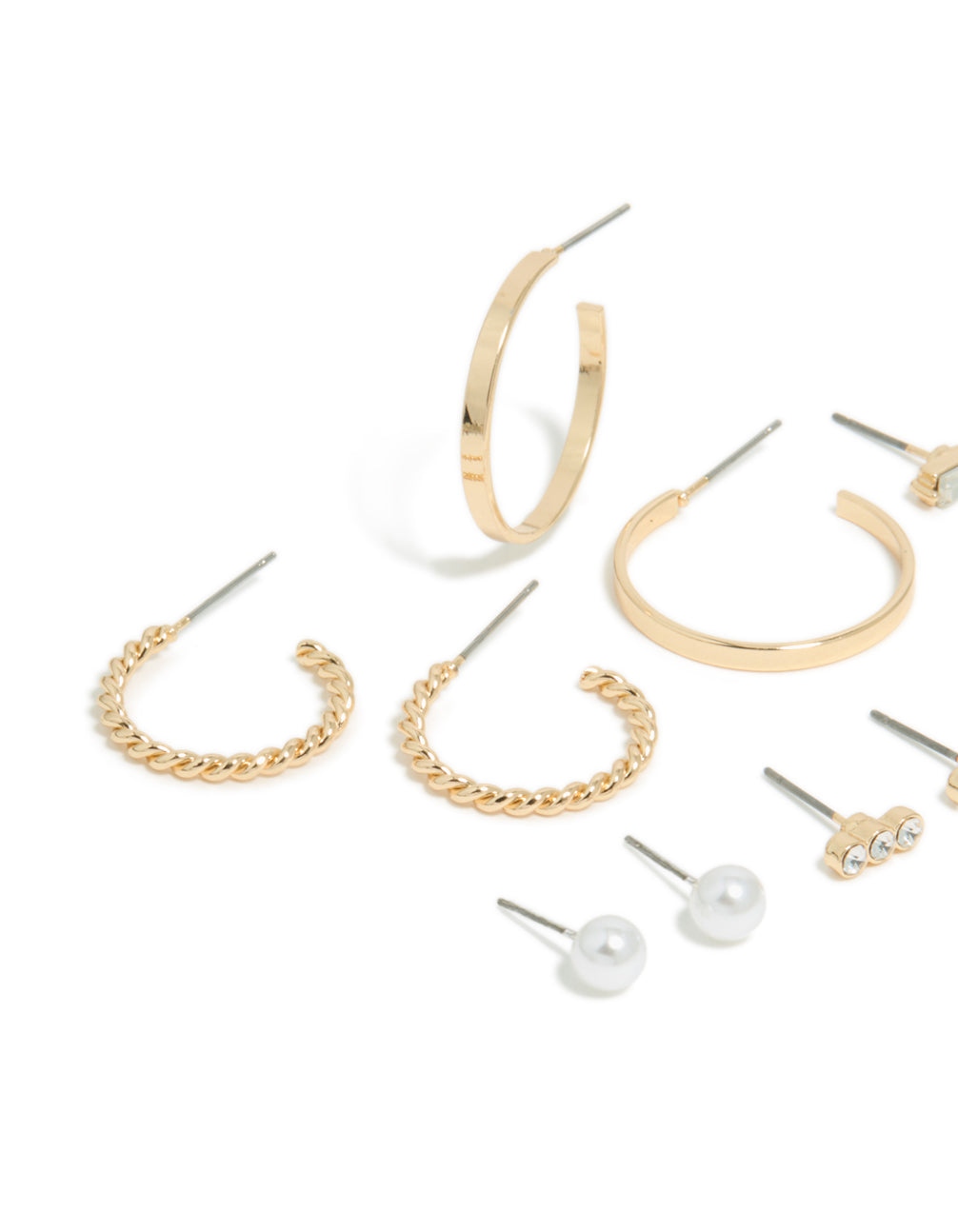 Crafted from gold, this mixed circle stud and hoop earrings 7-pack features bar details and pearl accents close up view