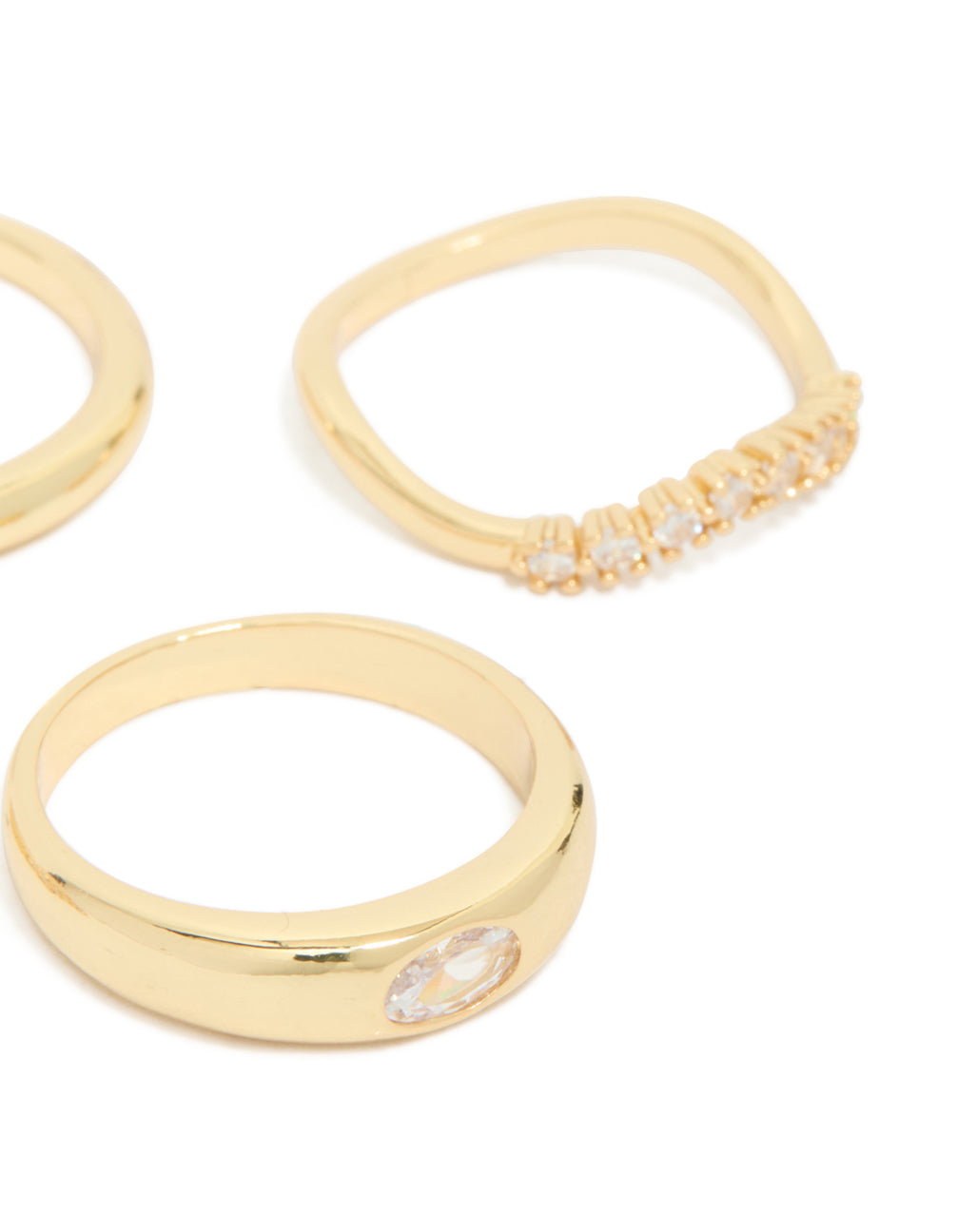 Crafted from gold plated material, this 4-pack of cubic zirconia and crystal rings designed with chunky stackable bands side detail view