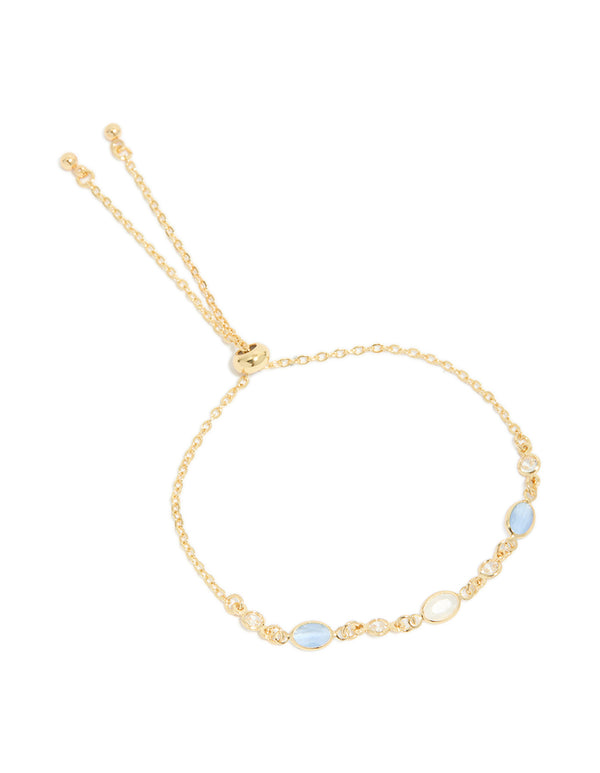 Discover this gold plated blue and beige oval cubic zirconia toggle bracelet in front view
