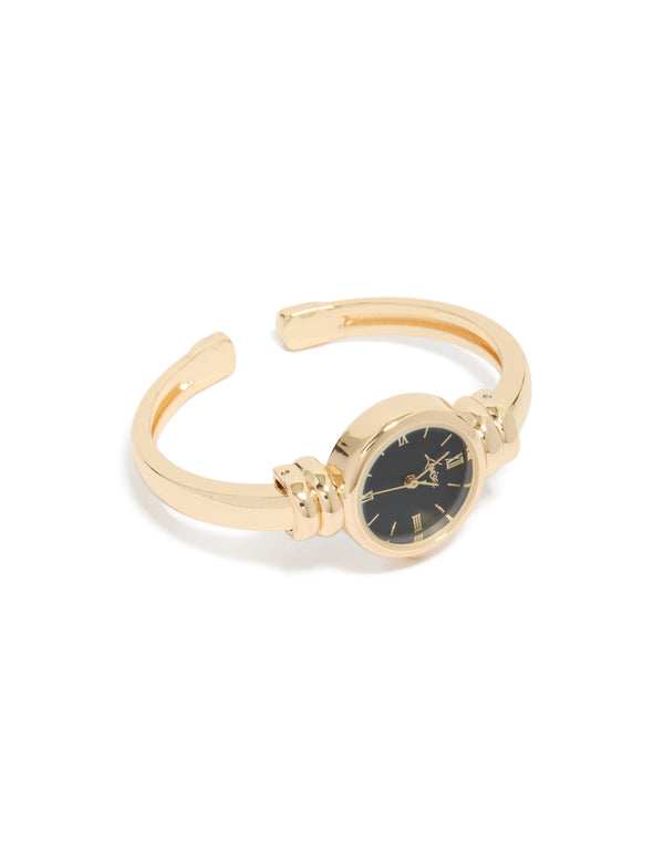 Featuring a gold plated bangle watch with black dial displaying roman numerals in round shape designed for women with bangle and casual analog styling front view