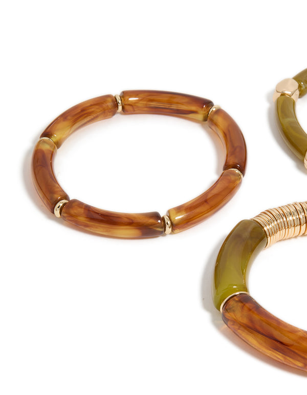 Highlighting brown and green resin stretch in gold bracelets in a 3-pack close up view