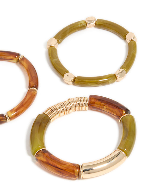 Highlighting brown and green resin stretch in gold bracelets in a 3-pack close up view