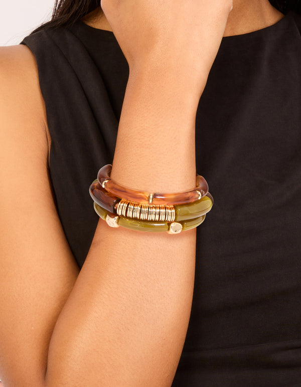 Showcasing brown and green resin stretch in gold bracelets in a 3-pack on wrist view