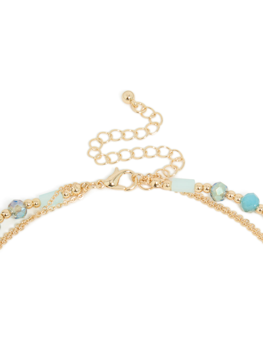 Explore this layered necklace with blue beads, tassel and oval pendant in statement styling in gold clasp detail view