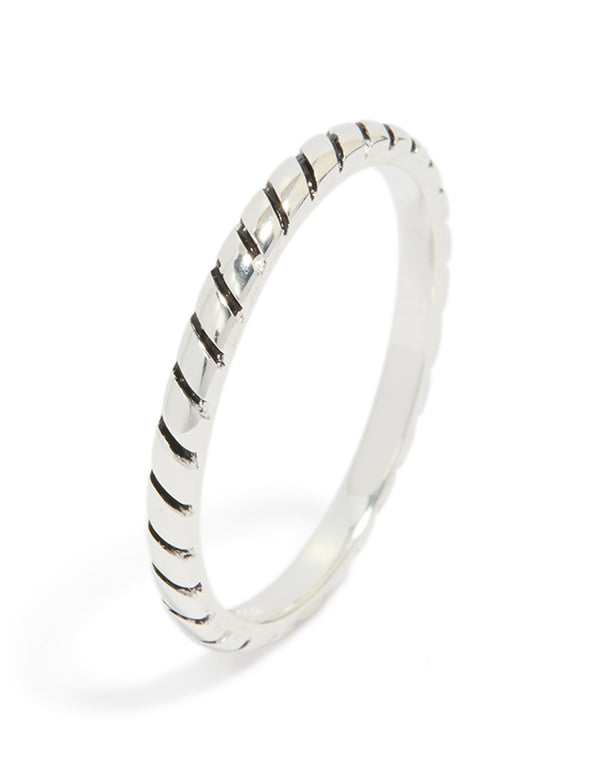 Presenting a textured black enamel ring crafted from sterling silver in statement style side detail view
