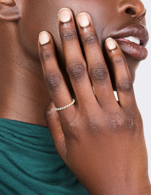 Showcasing a textured black enamel ring crafted from sterling silver with statement style on finger view