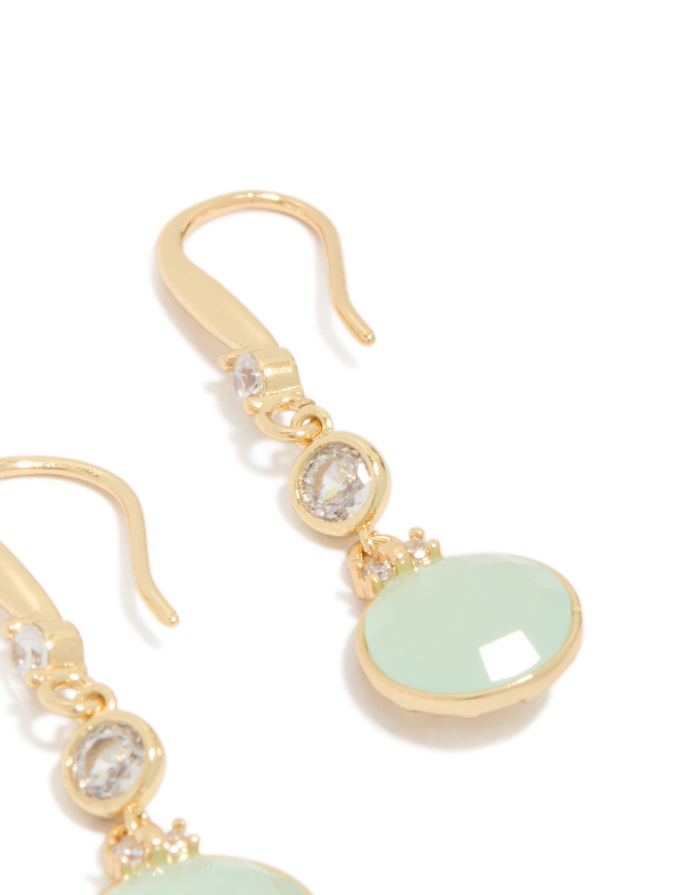 Crafted with dainty gold plated material, these blue cubic zirconia circle drop earrings feature pale turquoise stone detail post detail view