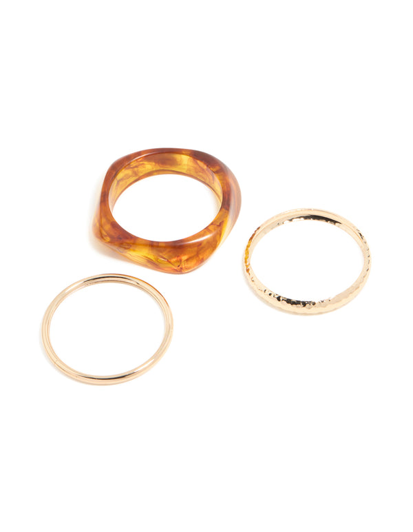 Discover gold and brown organic acrylic bangle pack with orange tones bangle front view