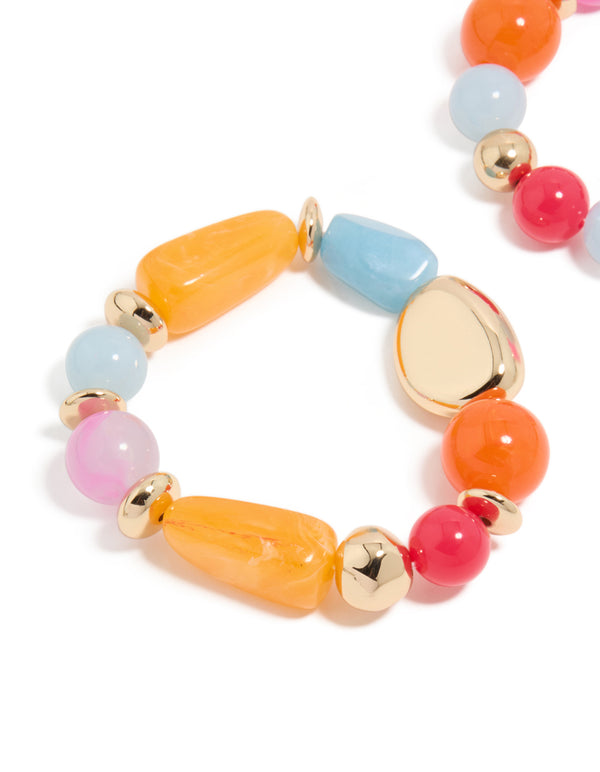 Highlighting acrylic beaded stretch bracelets with orange, pink, light blue, and gold accents in 2-pack close up view