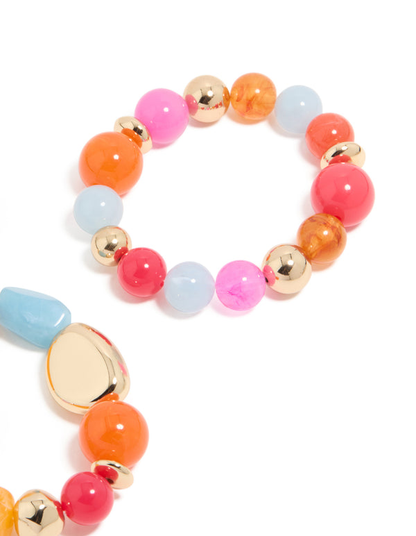 Highlighting acrylic beaded stretch bracelets with orange, pink, light blue, and gold accents in 2-pack close up view