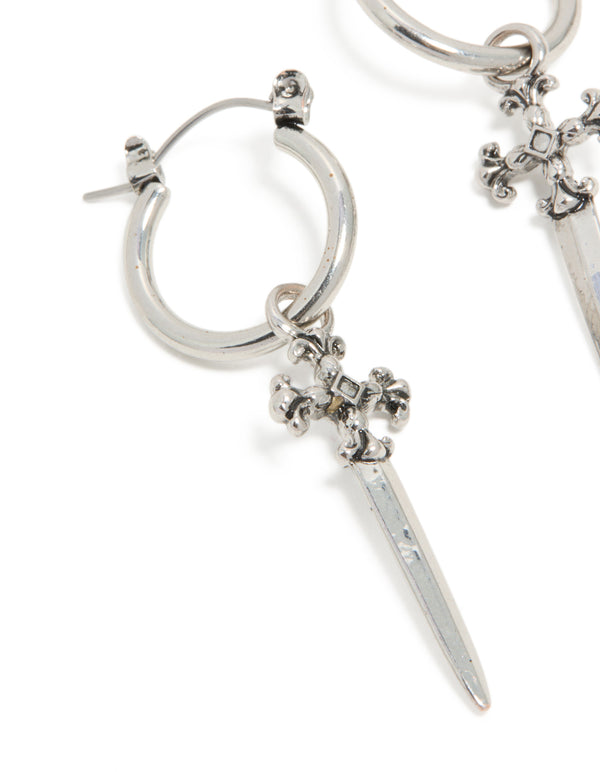 Discover these silver dagger hoop earrings with statement style featuring cross details close up view