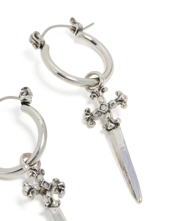 Crafted with statement style, these silver dagger hoop earrings feature cross details post detail view