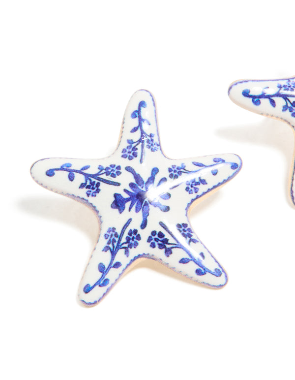 Crafted with painted starfish stud earrings showcasing floral and ocean details in white and blue close up view