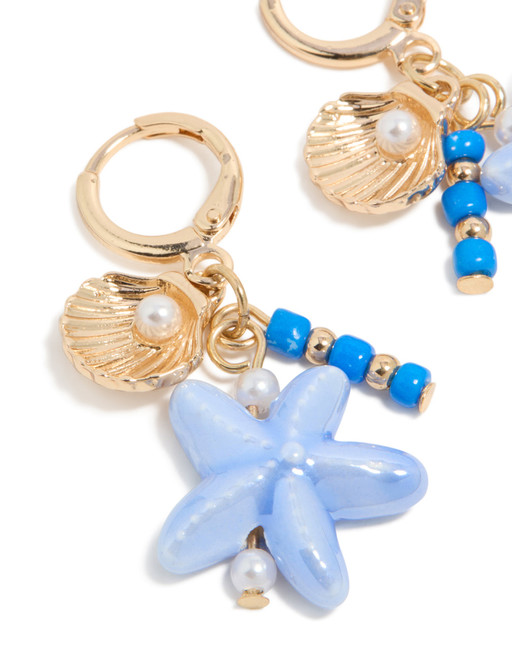 Stunning gold sea life charm huggie earrings with ocean-themed shell, beads, pearls, and starfish details in a close up view