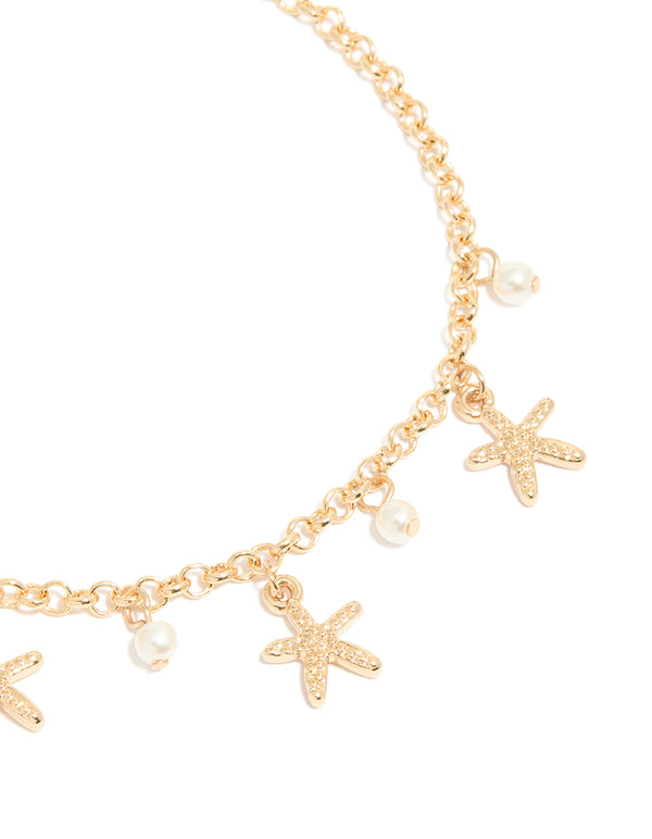 Showcasing gold shell and starfish anklets 3-pack with ocean-inspired charm details and pearls detail view
