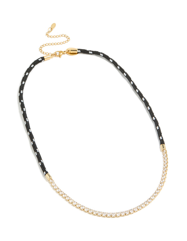 Presenting a waterproof tennis necklace in gold plated stainless steel with black cord, statement design front view