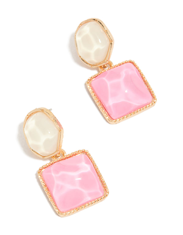 Showcasing statement drop earrings with round and square organic pink pool effect accents in gold front view