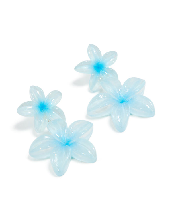 Showcasing blue acrylic frangipani flower drop earrings featuring in light cyan and aqua front view