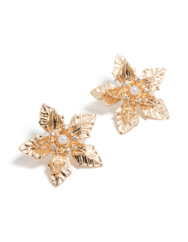Dainty gold textured flower stud earrings featuring floral with pearl accents front view