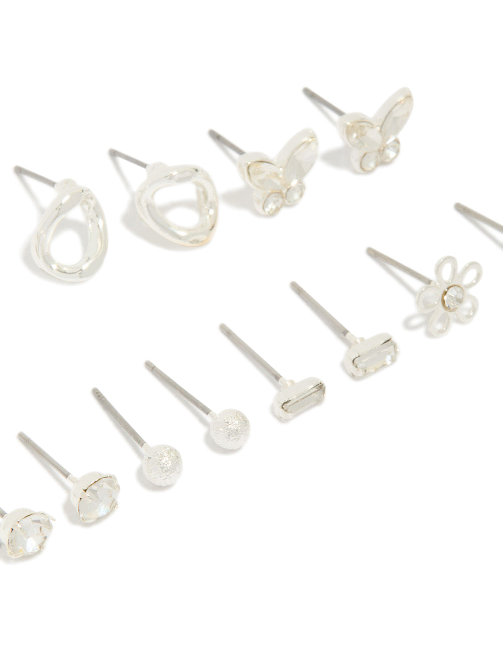 Featuring silver and diamante teardrop earrings 7-pack featuring butterfly, ball, and floral accents with clear stone details and stud closure close up view