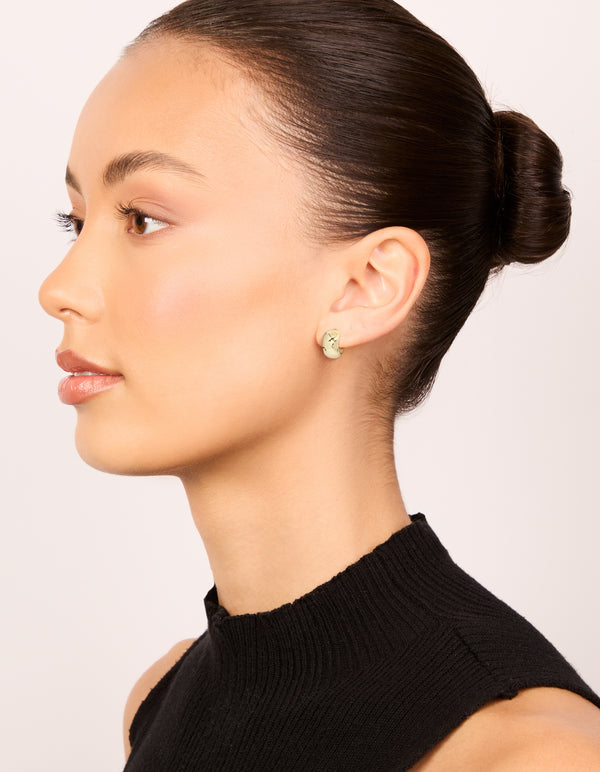 Crafted from mixed metal plated small round open hoop earrings in a 3-pack featuring gold and silver tones on model view