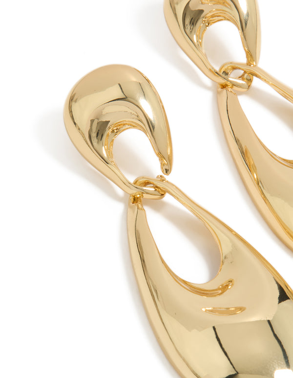Designed with gold plated material, these elongated oval drop earrings highlight surface texture and connecting hardware close up view