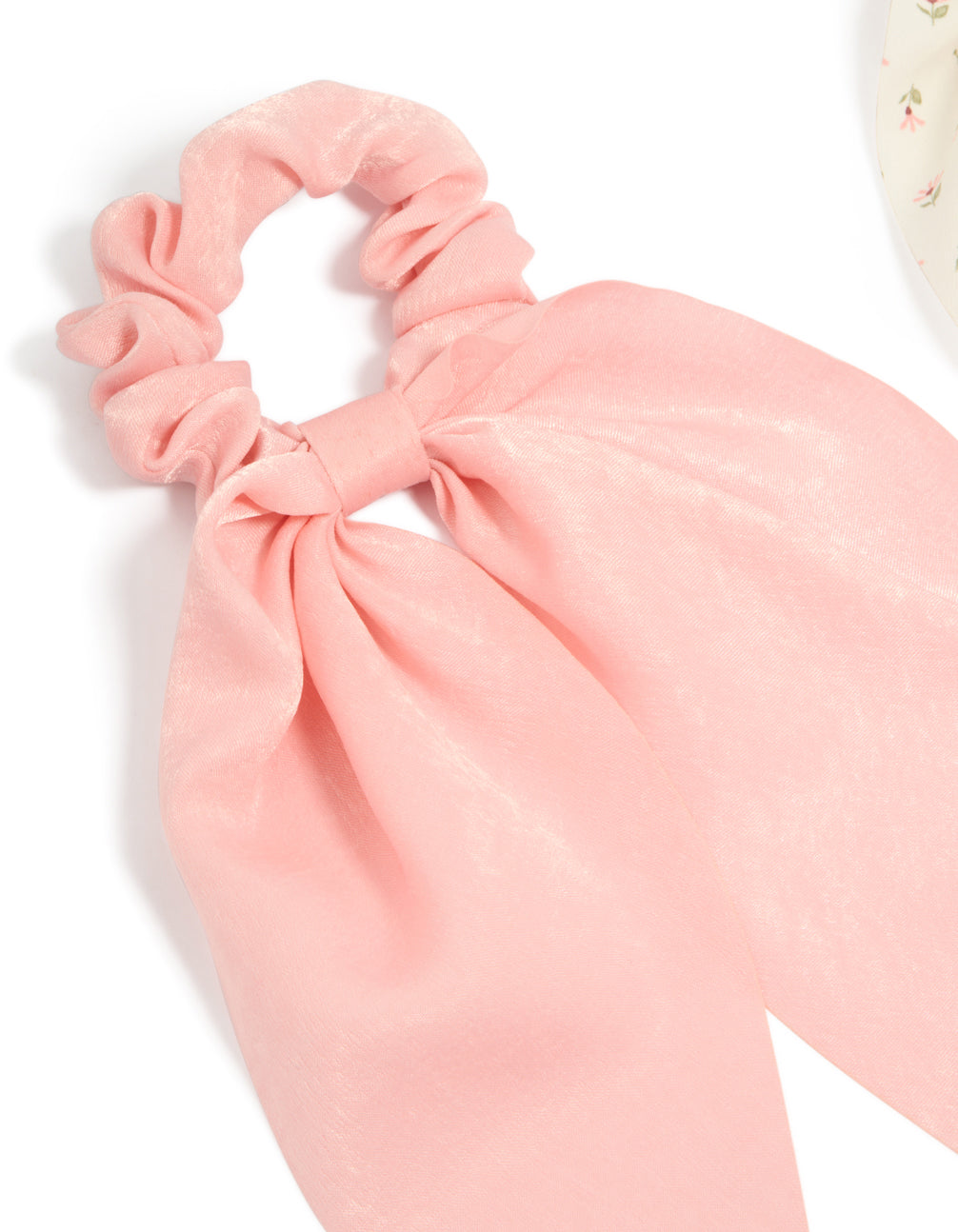 Crafted with bow detail in floral pattern, this 2-pack set features light pink, ivory, pink, and olive printed flowers and fabric scarf scrunchies detail view