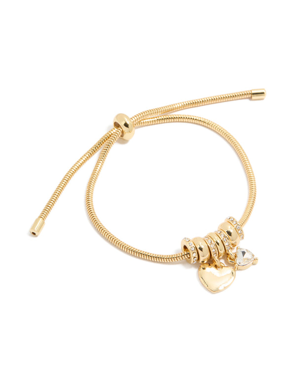 Showcasing a gold plated cubic zirconia chunky heart charm toggle bracelet with statement design front view