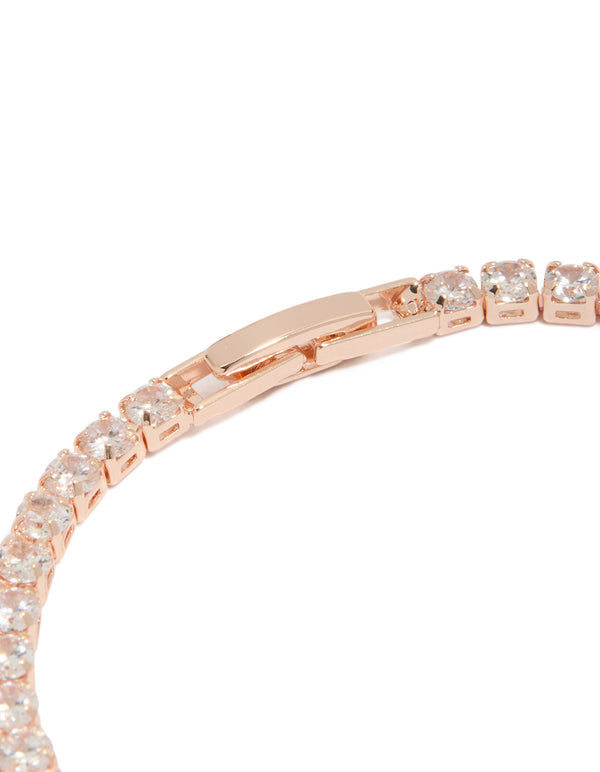 Designed with rose gold plated cubic zirconia mixed charm tennis bracelet featuring butterfly and heart charms closure detail view
