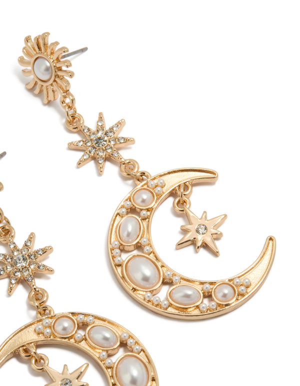 Highlighting gold pearl celestial drop earrings post detail view