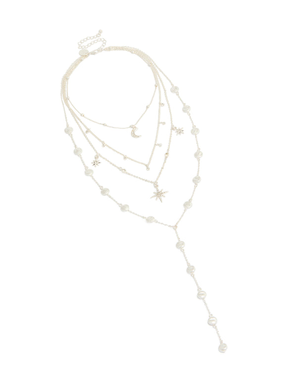 Crafted from silver, this diamante celestial multi pearl layered Y-necklace features charm, star, and moon accents in statement design front view