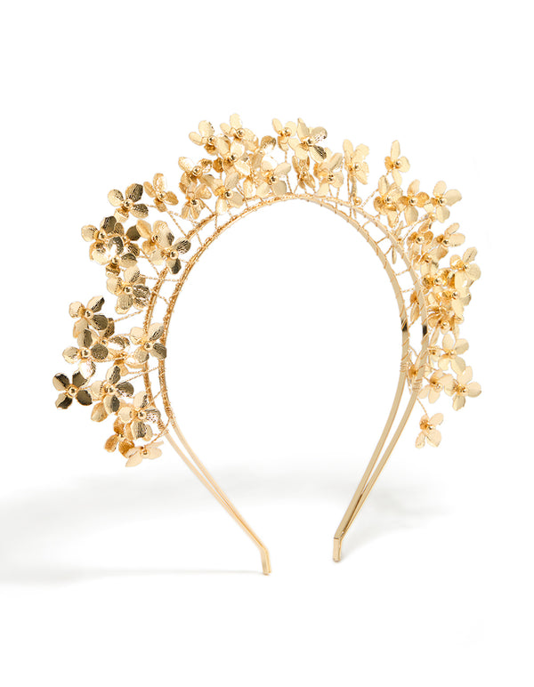 Featuring a gold wire flowers layered headband in statement style front view