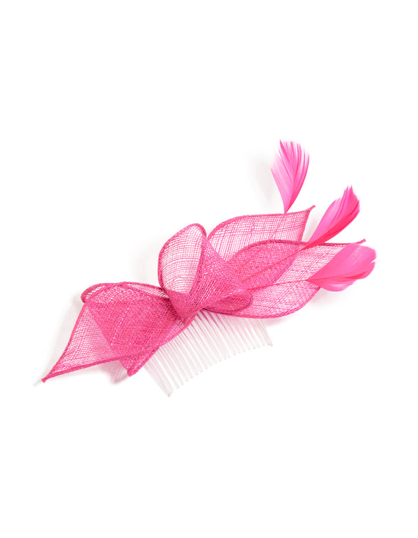 Showcasing a statement fascinator hair comb with feathers and floral petal in hot pink and white front view