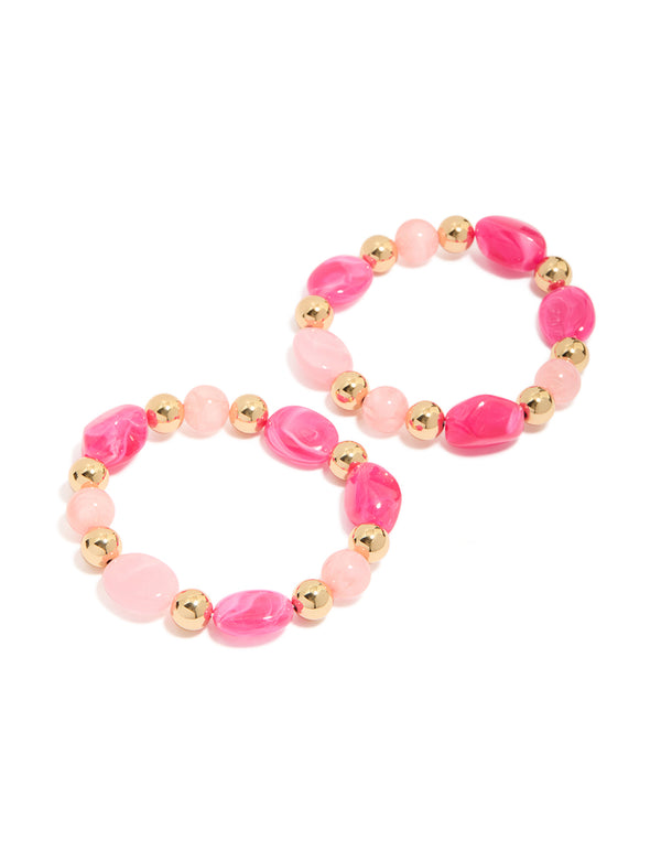 Experience vibrant beaded stretch bracelets in a 2-pack featuring hot pink and light pink acrylic beads with gold accents front view