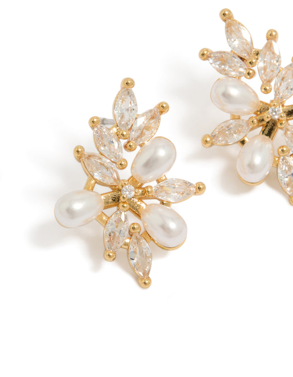 Beautifully designed organic flower statement earrings with gold plated metal, pearls, and cubic zirconia in ivory tones close up view