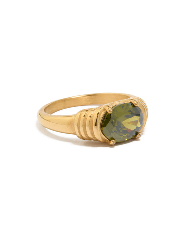 Showcasing a waterproof gold plated stainless steel ring with oval green cubic zirconia in a chunky style side detail view