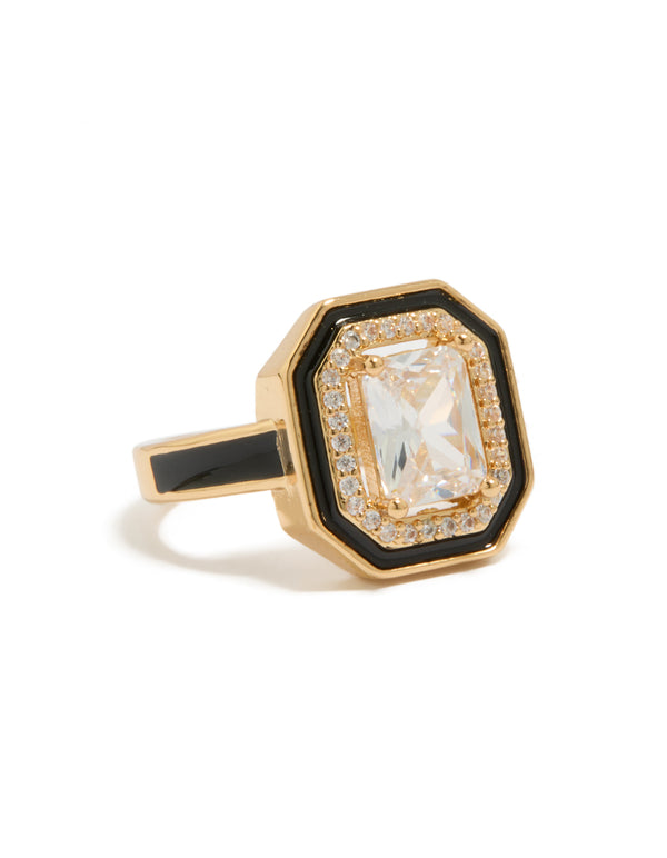Showcasing a gold plated black enamel outline cushion cut cubic zirconia ring with crystal detailing and statement styling front view