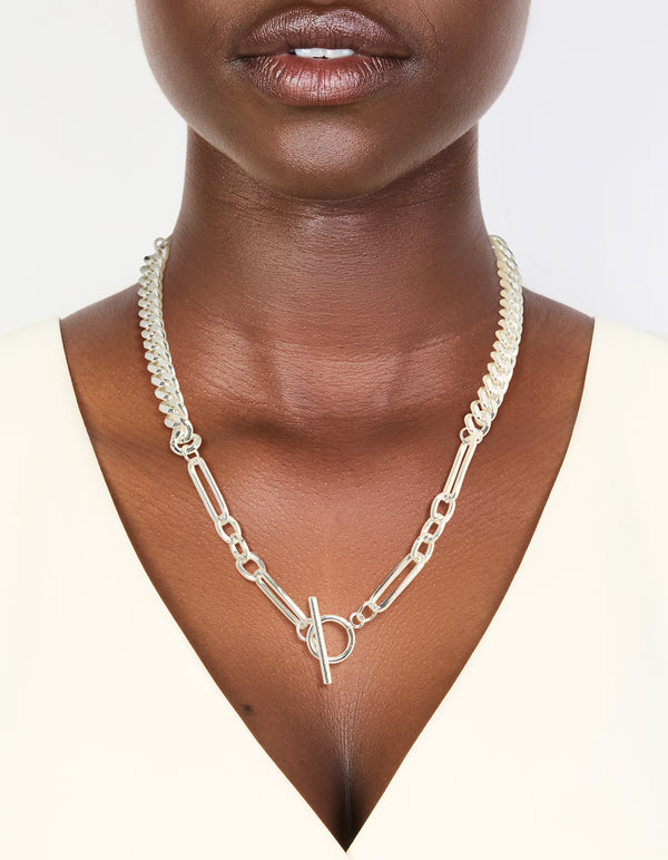 Presenting a waterproof stainless steel long curb chain toggle necklace with silver plated finish in statement style on neck view