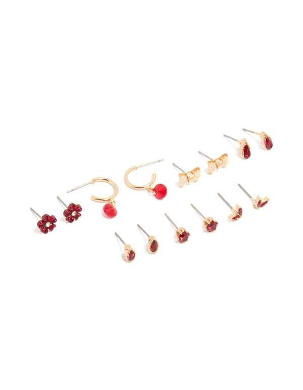 Showcasing a gold red flower and bow earrings 7-pack featuring floral designs with stud and huggie closures in maroon front view