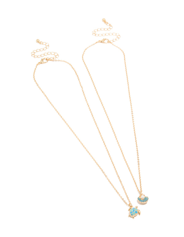 Showcasing gold turtle and shell necklaces in a 2-pack with ocean-inspired pearl accents front view