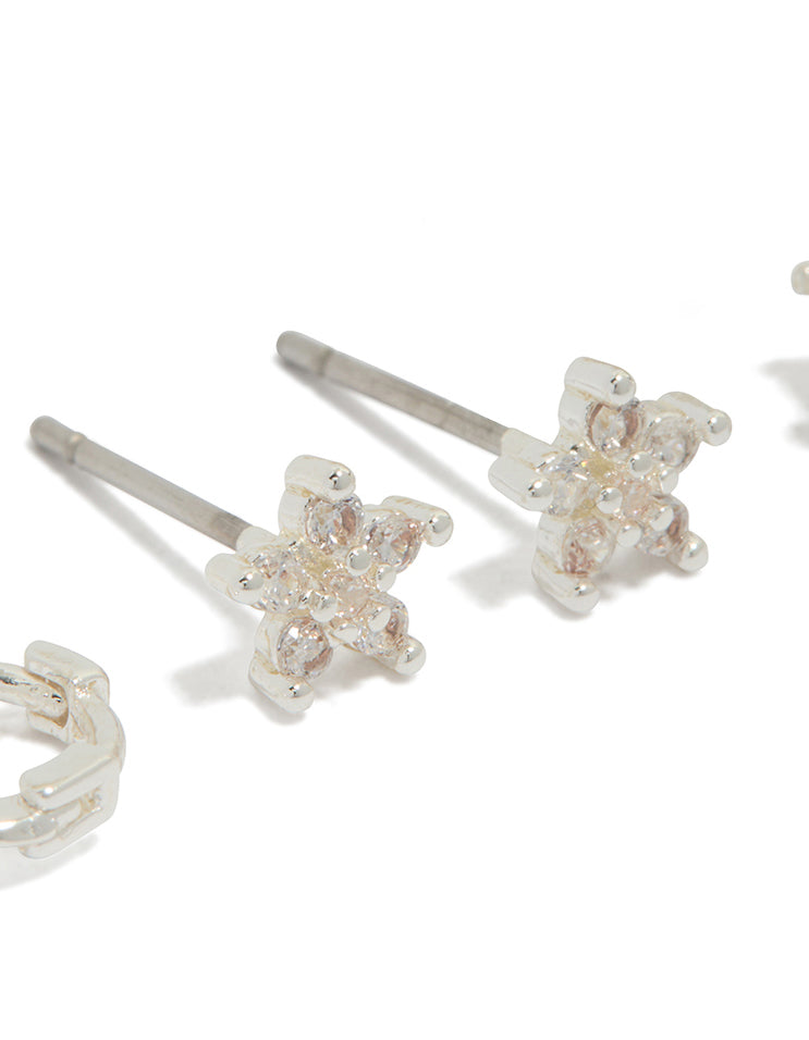 Designed with Cubic Zirconia in silver Flower Stud and Huggie Earrings close up view