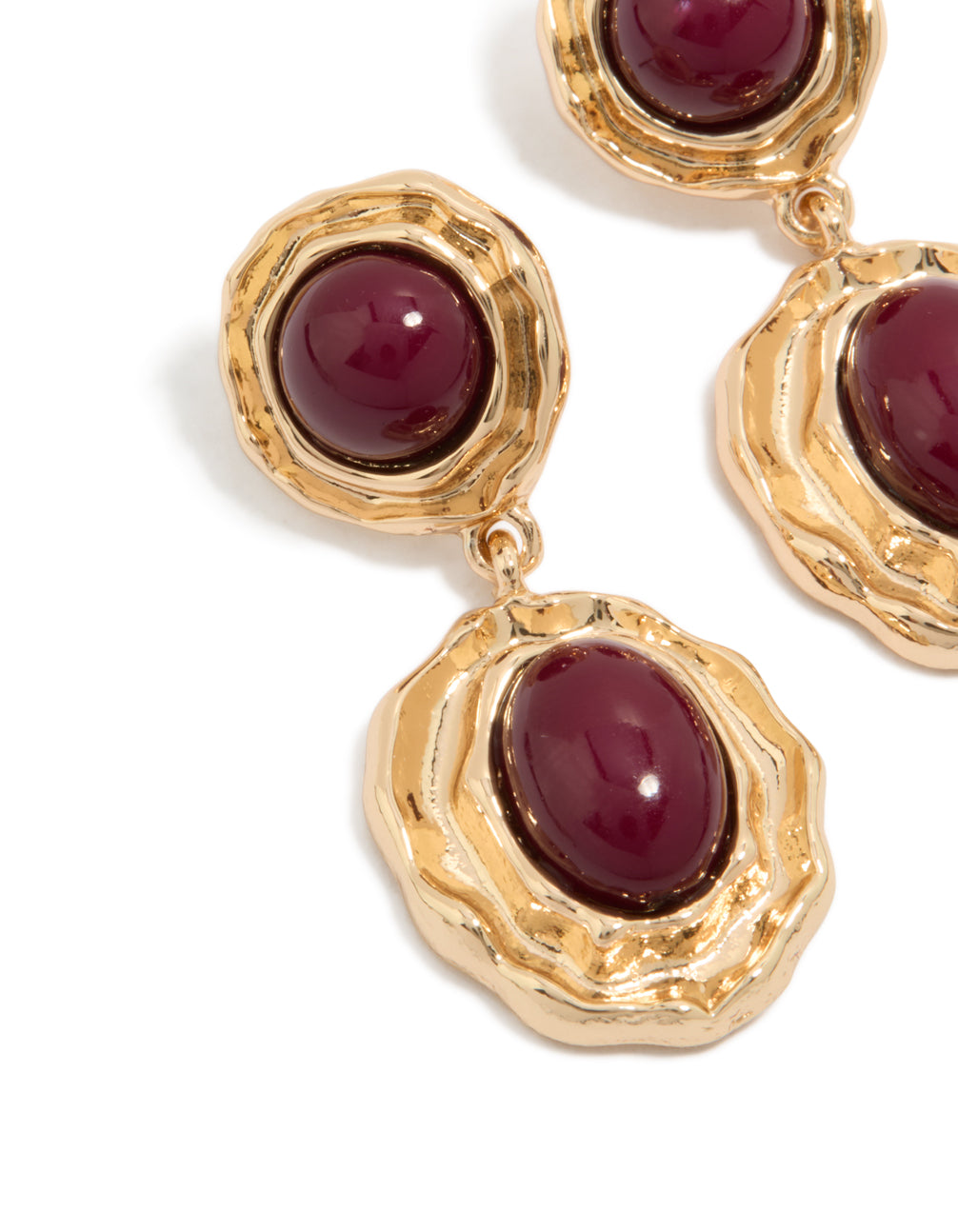 Highlighting gold double burgundy resin drop earrings crafted from statement materials in maroon close up view